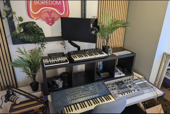 Enemy Of Boredom Academy music room Bracknell for the Alternative Provision music course. Rack of drum machines and synthesisers photo.